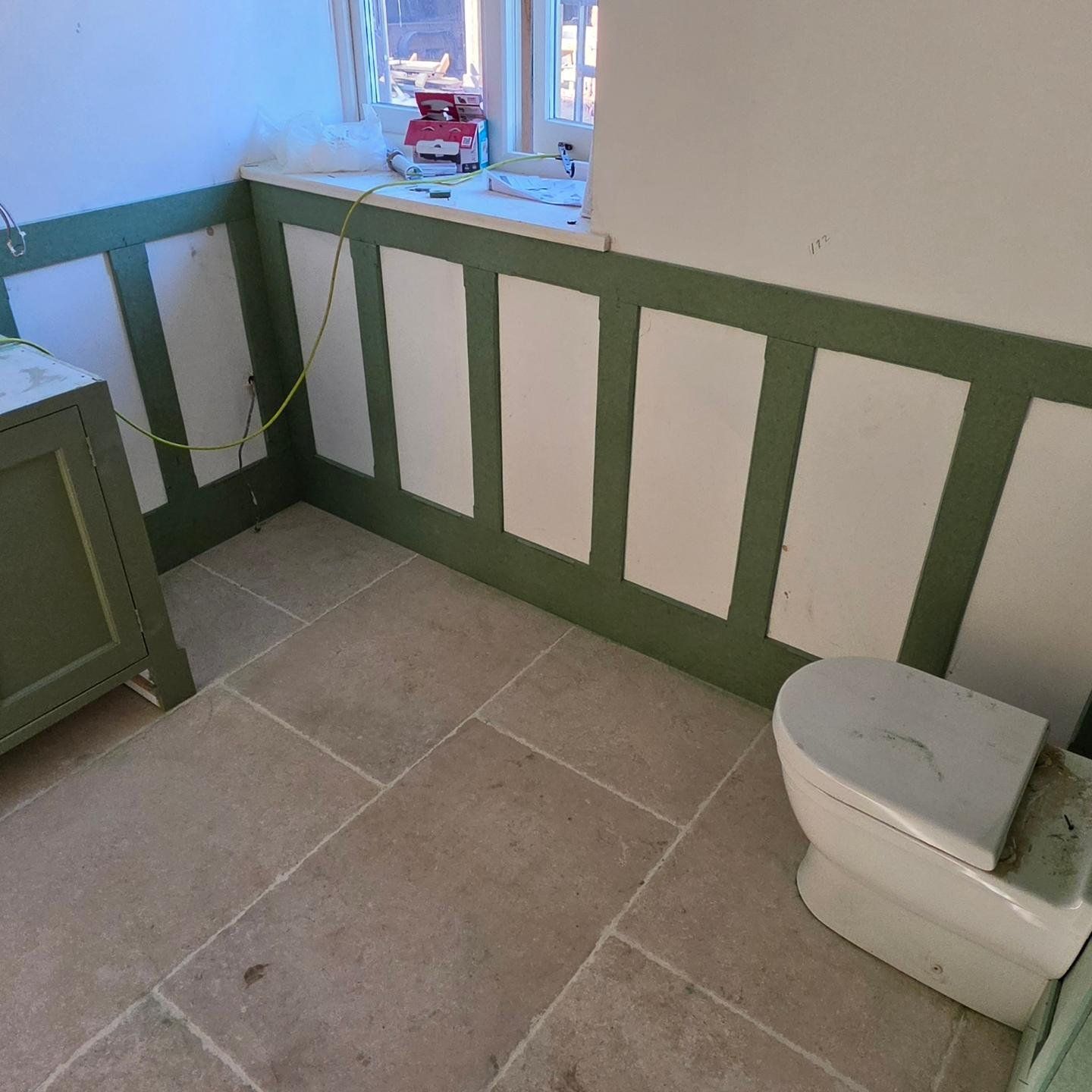 Bathroom makeover with green panelling